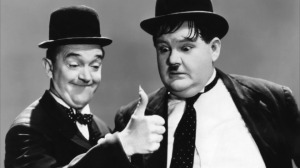 Stan Laurel and Oliver Hardy, one of Hollywood's most peculiar (and successful) comedy teams.  From the 1937 movie Way Out West (source:  TimeOut.com)